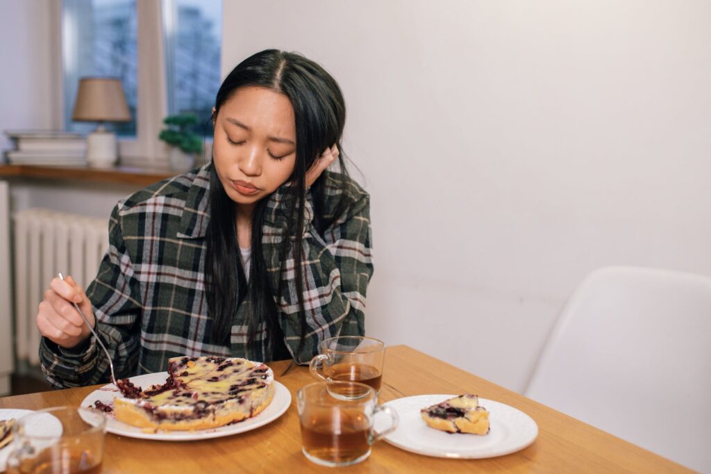 a sad woman in black plaid long sleeves