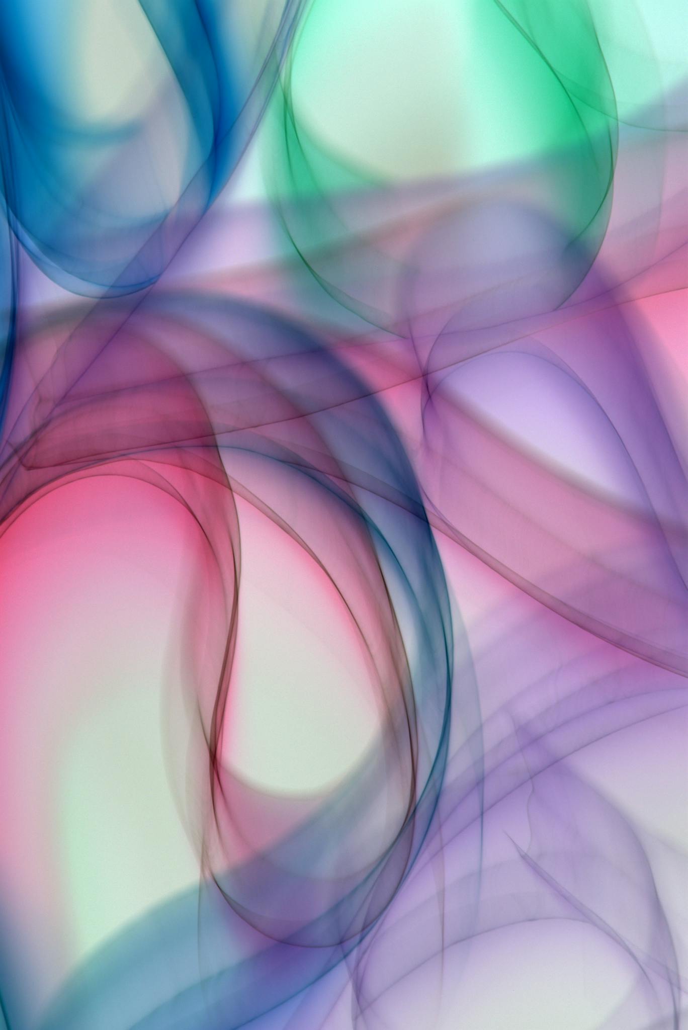 Dynamic abstract art featuring colorful, flowing swirls and soft gradients.